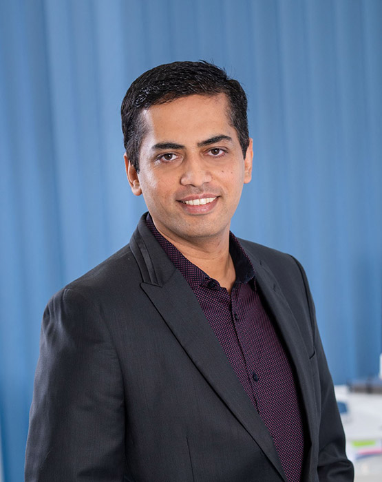 Individual and group portraits of the team at Live Well Healthca